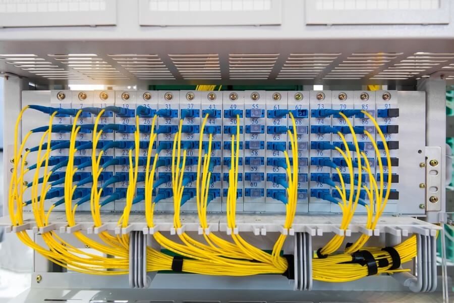 Installed fiber optic patch panel with labeled connectors