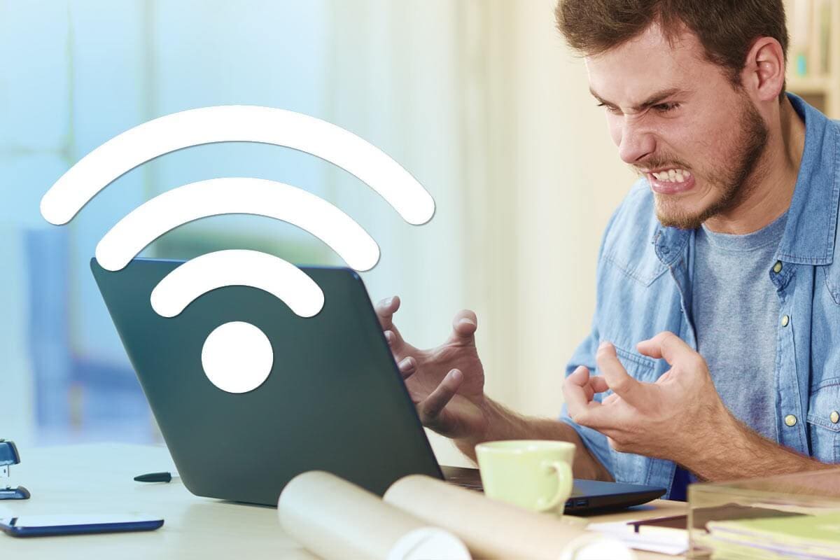 Office workers frustrated with laptops and mobile devices due to poor Wi-Fi connectivity.